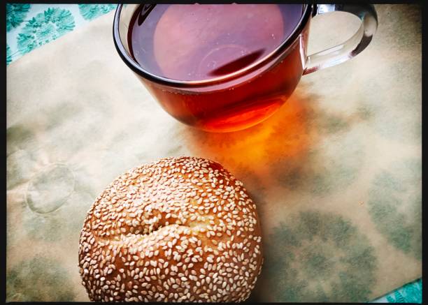 Cup of Tea and Sesame Bagel