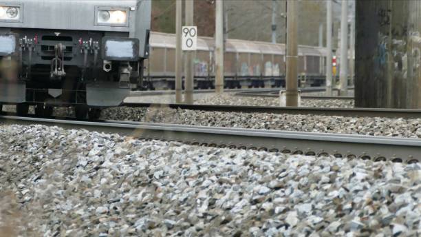 istock Appearing freight train on a railroad track 1298184830