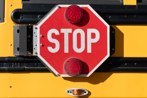 istock Stop sign on the side of a school bus 1298184933