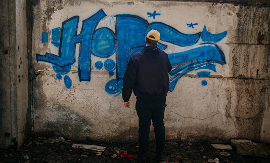 Graffiti Writer Spraying on Wall