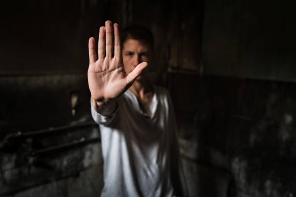 istock Young man showing STOP sign with his palm 1298186830