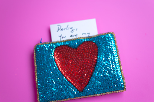 Love Note in Heart Purse, Pink Background