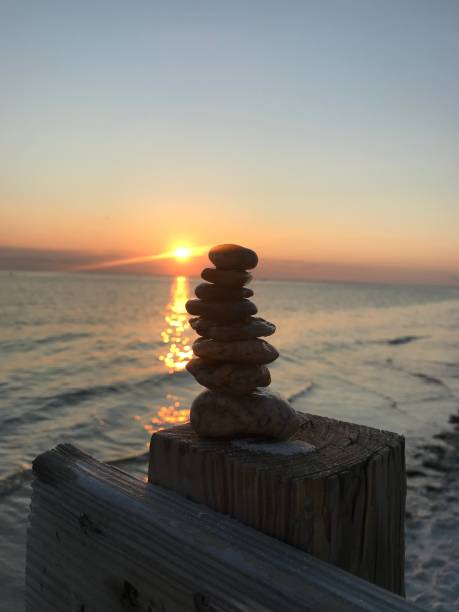 istock Rock Tower Sunset Kiss The Water 1298189400