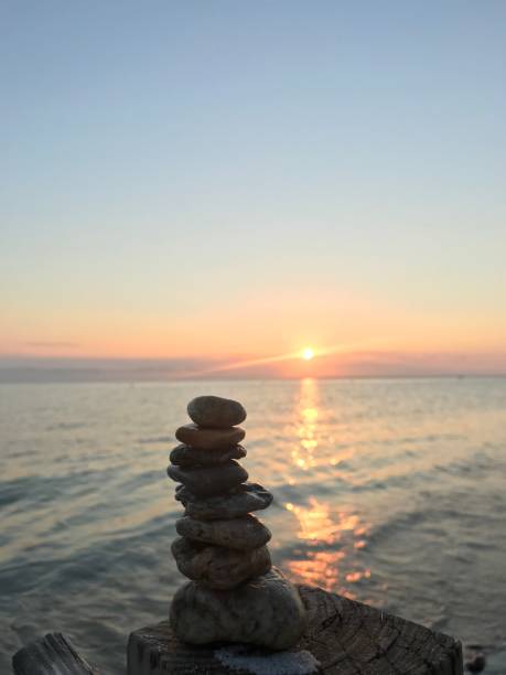 istock Rock Tower Sunset Kiss The Ocean 1298189426