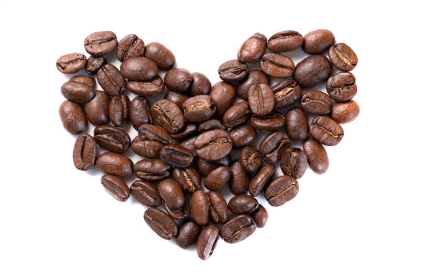 istock Coffee beans in heart shape on white background 1298191519