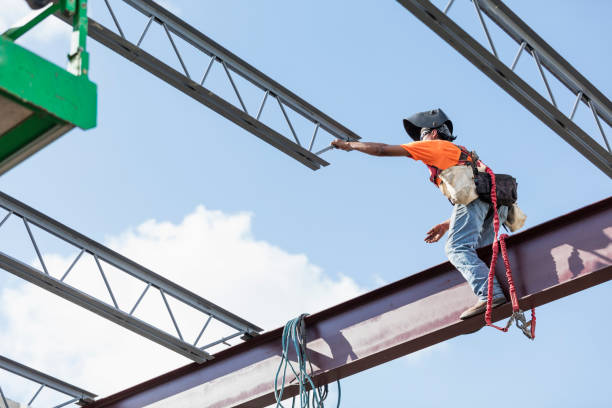 istock Ironworker at construction site installing roof joist 1298192088