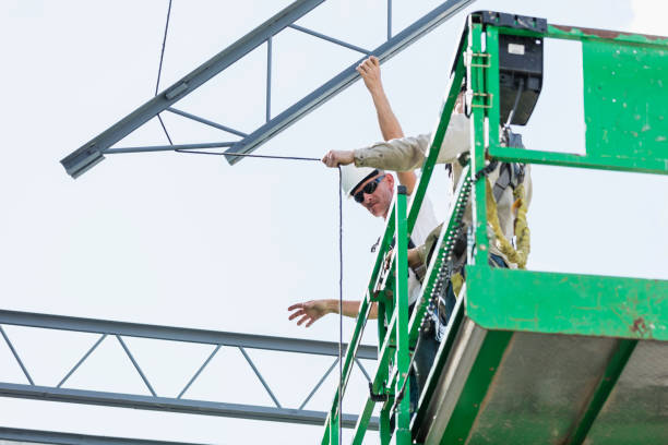 istock Ironworkers at construction site installing roof joist 1298192100