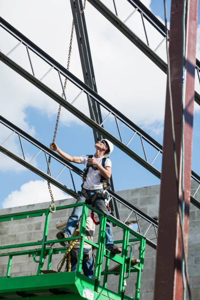 istock Steel worker installing roof trusses 1298192132