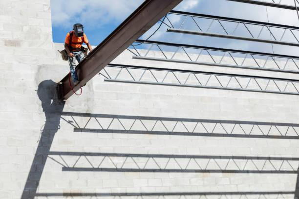 istock Ironworker at construction site installing roof joist 1298192154