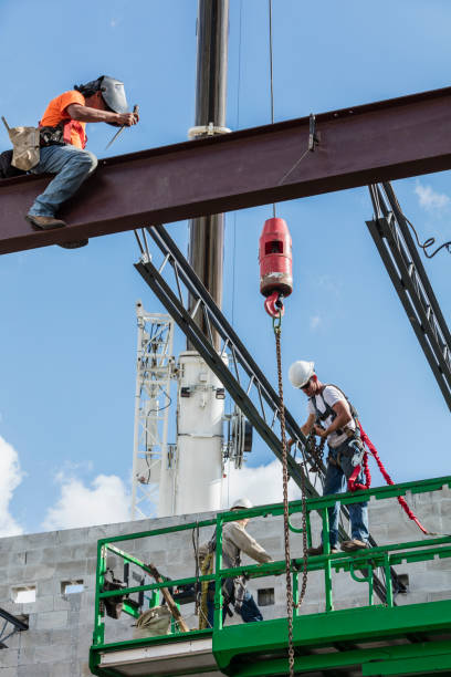 istock Crew installing roof joists at construction site 1298192169