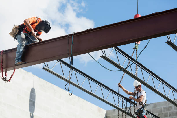 istock Crew installing roof joists at construction site 1298192170