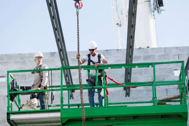 istock Steel workers installing roof trusses 1298192202