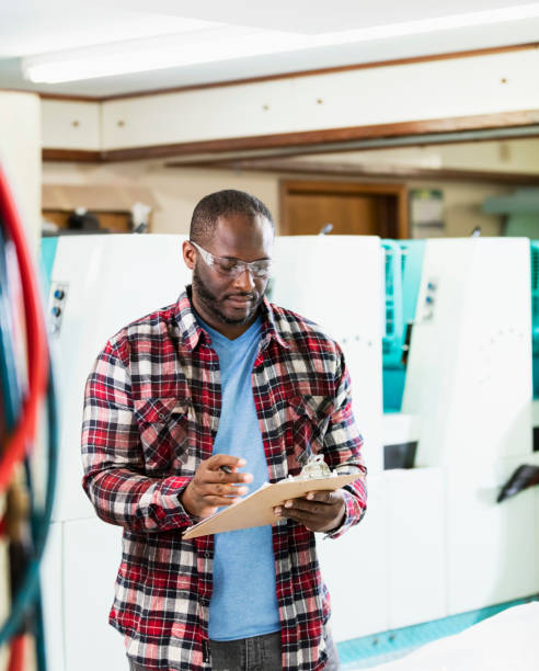 istock African-American man working in printing plant 1298192562