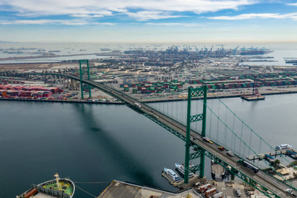istock Vincent Thomas Bridge looking to container shipping port. 1298192591