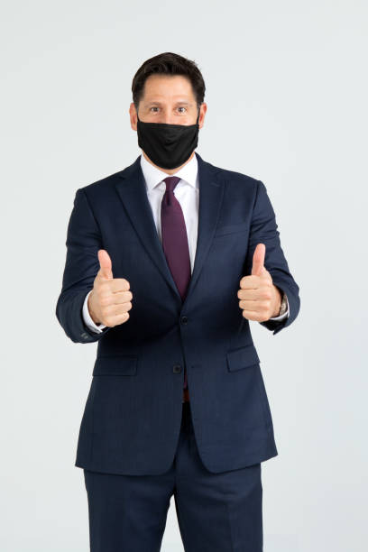 istock Businessman wearing a mask 1298196253
