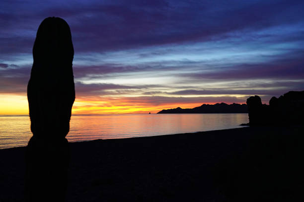 Dramatic sunrise light where the Sierra de la Giganta meets the Sea of Cortez south of Loreto. Baja California Sur, Mexico.