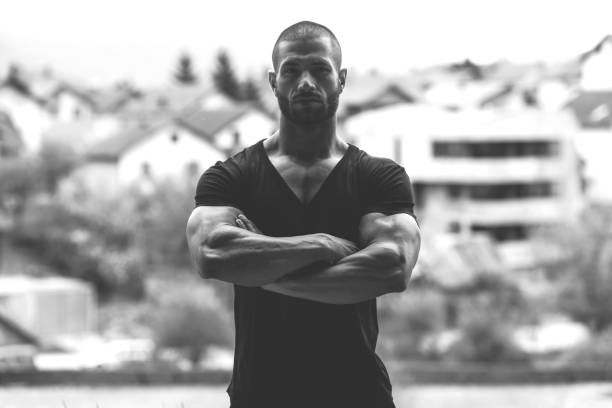 istock Strong Man Posing Outdoors 1298198276