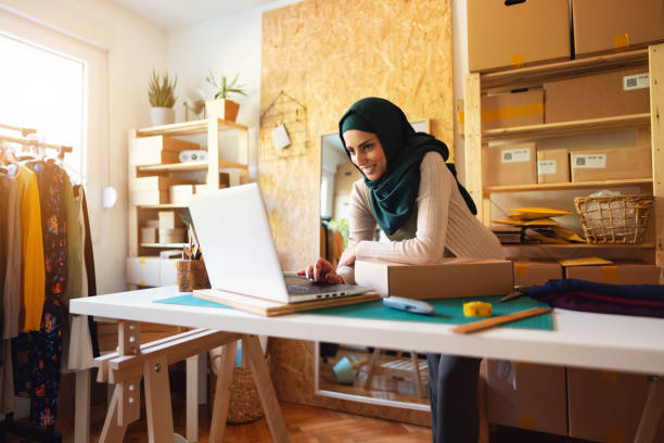 Small business owner  doing e-commerce business on the laptop
