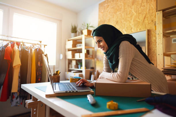 istock Small business owner  using laptop at home office 1298198898