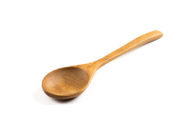 istock Wooden spoon isolated on white . 1298199145