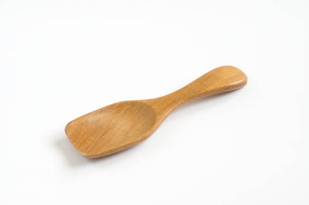 istock Wooden scoop isolated on white background. 1298199151