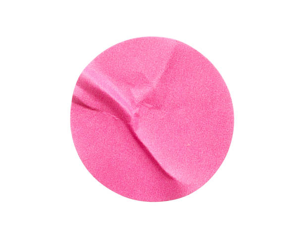 istock Blank pink round adhesive paper sticker label isolated on white background 1298199168