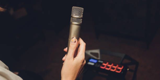 istock Image the announcer speaks into a microphone. 1298199403