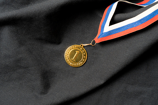 golden medal for the first place reward, success at the competition concept