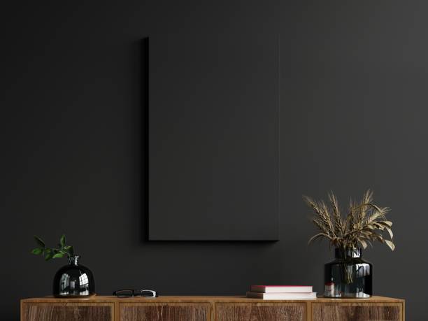 istock Mockup frame on cabinet in living room interior on empty dark wall background. 1298207779