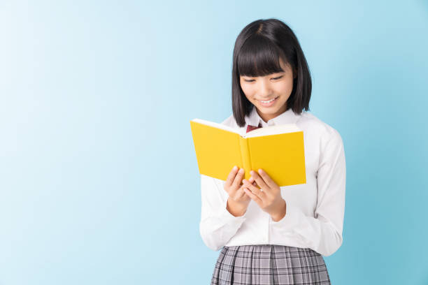 istock girl who reads a book,School uniform, 1298207782