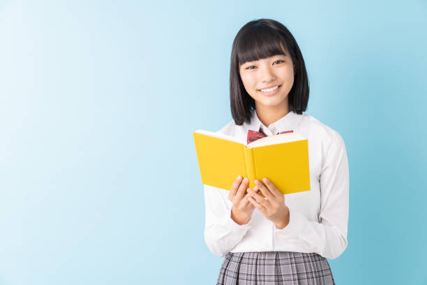 istock girl who reads a book,School uniform, 1298207794