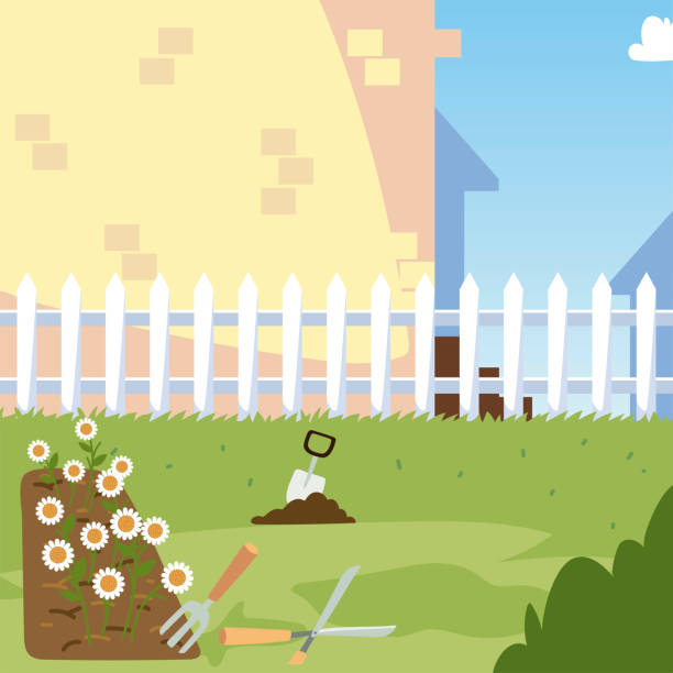 istock gardening, flowers bed trowel bush grass and fence yard 1298209552