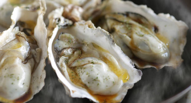 istock Grilled oysters with shells in butter and soy sauce 1298210528