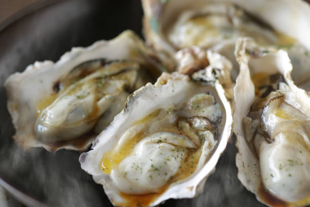 istock Grilled oysters with shells in butter and soy sauce 1298210532