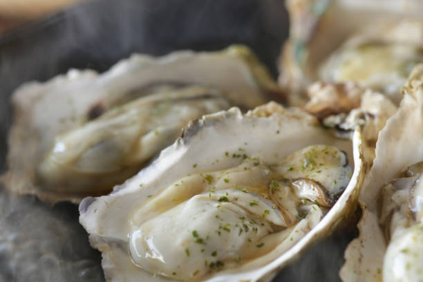istock Grilled oysters with shells in butter and soy sauce 1298210535
