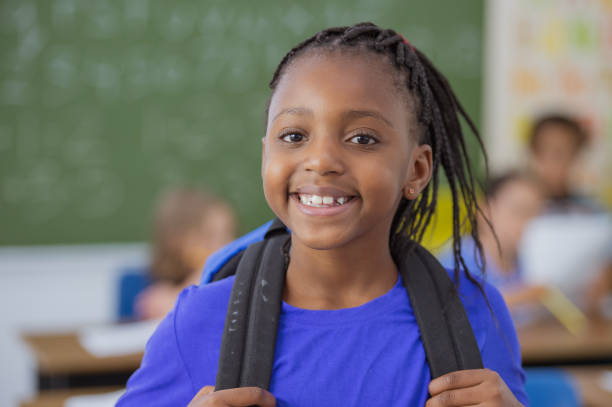 istock Elementary school girl smiling at camera 1298212642