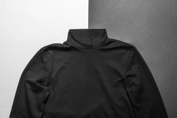 istock Men's black knitted sweater on black and white background. 1298215553