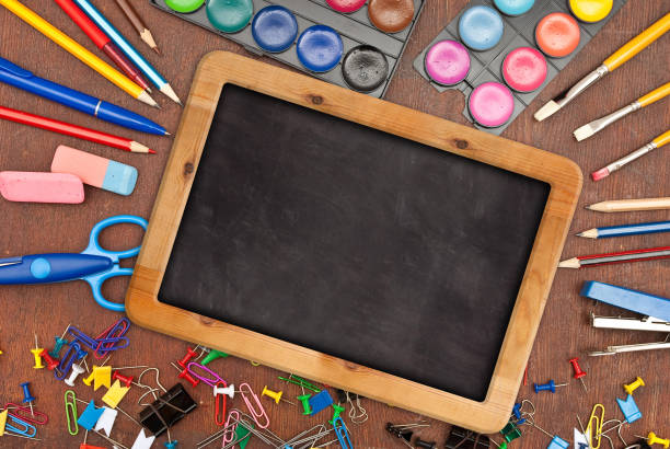 istock Chalk blackboard with school supplies 1298215596