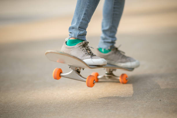 istock Skateboarder skateboarding outdoors on sunny morning 1298224898