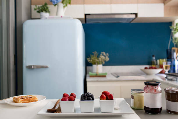 istock Berries and jam ingredients and waffle for breakfast in beautiful kitchen background 1298226184