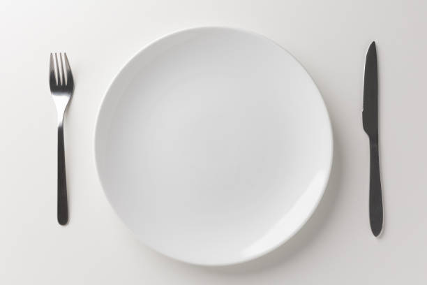 istock White empty plate set Placed with a knife and fork Ready for food menu 1298227007