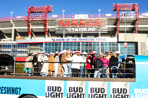 January 23, 2020 - Nashville, Tennessee, U.S.: A large group of bachelorettes on a party bus pose for a photo in front of Nissan Stadium.