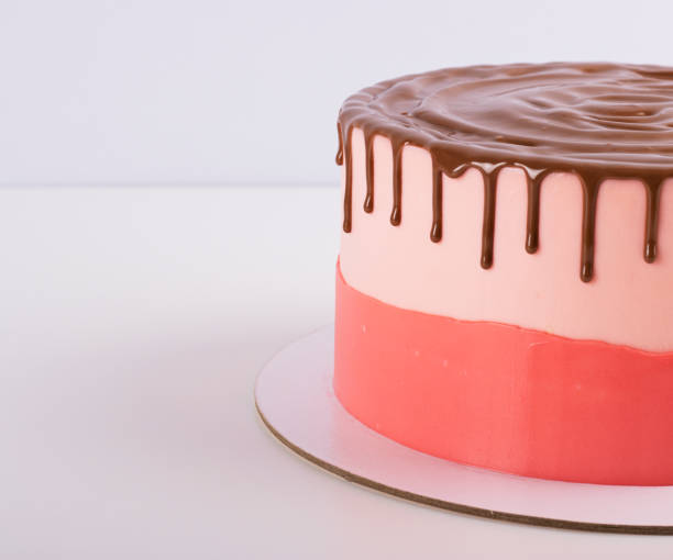 istock Sponge cake with chocolate smudges and cream cheese cream 1298232372