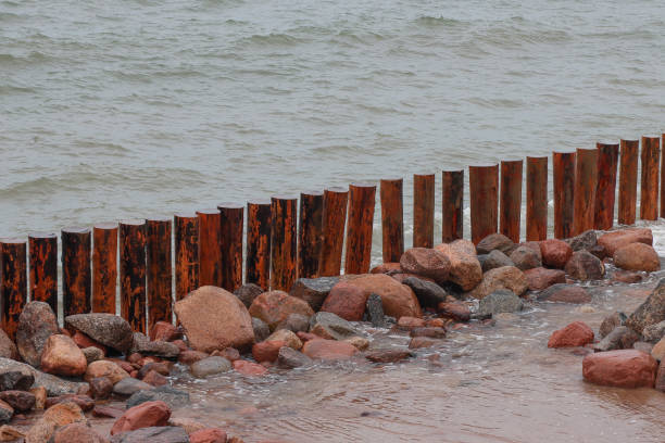 istock Fencing, breakwater at sea. 1298234588