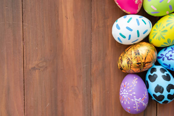 istock Easter eggs on wooden background with copy space,Colorful and handmade paint on eggs for easter day traditional in Europe,Easter Day Concept 1298235215