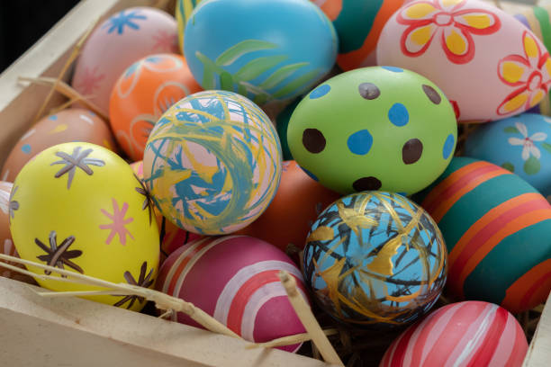 istock Easter eggs on wooden background with copy space,Colorful and handmade paint on eggs for easter day traditional in Europe,Easter Day Concept 1298235240