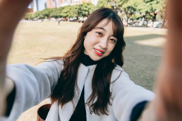young woman smile take selfie
