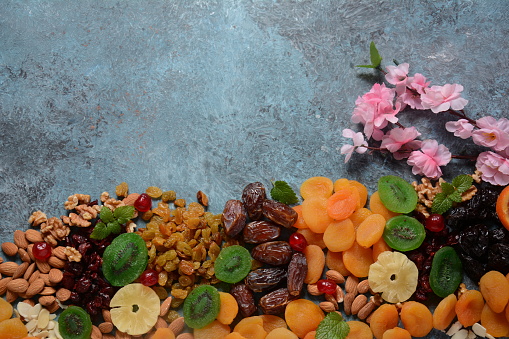 Mix of dried and sun-dried fruits, and nuts. Kiwi, apricot. Symbols of the Jewish holiday of Tu BiShvat
