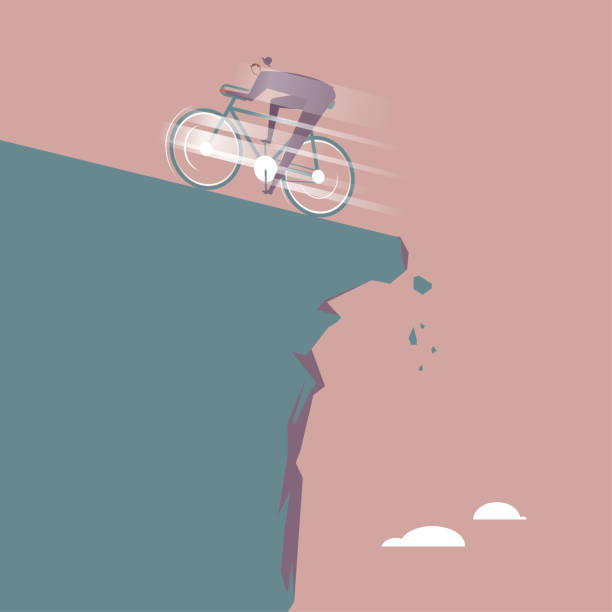 istock Businessman riding a bicycle to escape the cliff. 1298237223