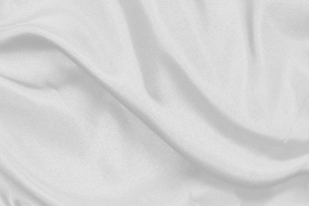 istock Smooth elegant white silk fabric or satin luxury cloth texture can use as wedding background. for drapery luxurious abstract design 1298238209